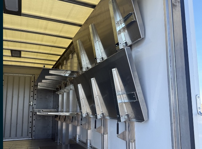 Package D Fixed Front / Folding Rear shelving in a Workhorse W56 step van, rear folding shelves stowed flat against the wall.