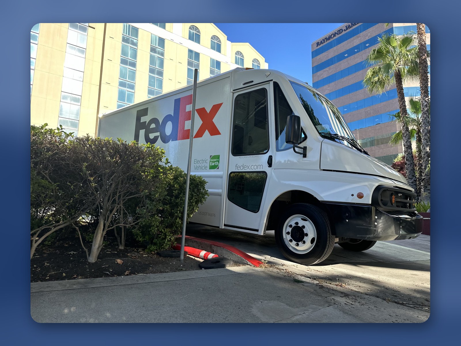 A Workhorse W56 step van in FedEx livery parked at a commercial building in Southern California.