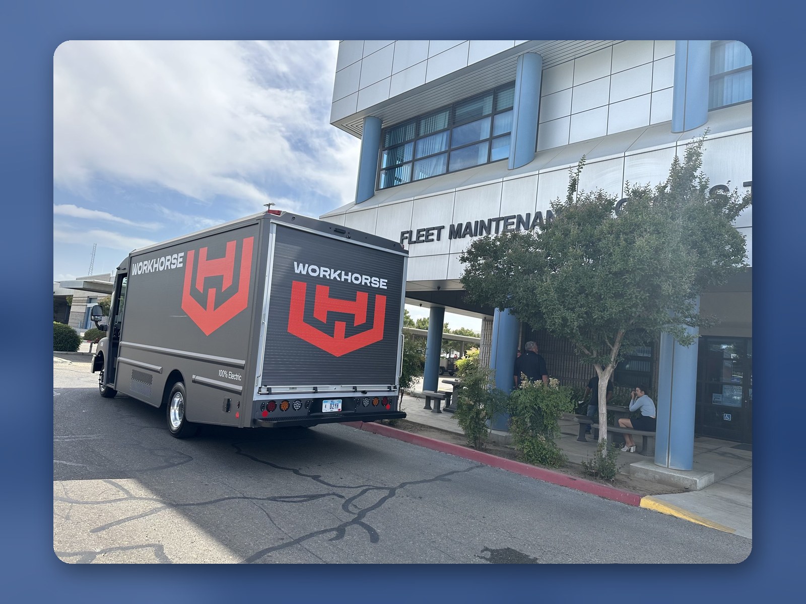 A Workhorse W56 step van with Workhorse branding parked outside a fleet maintenance facility.