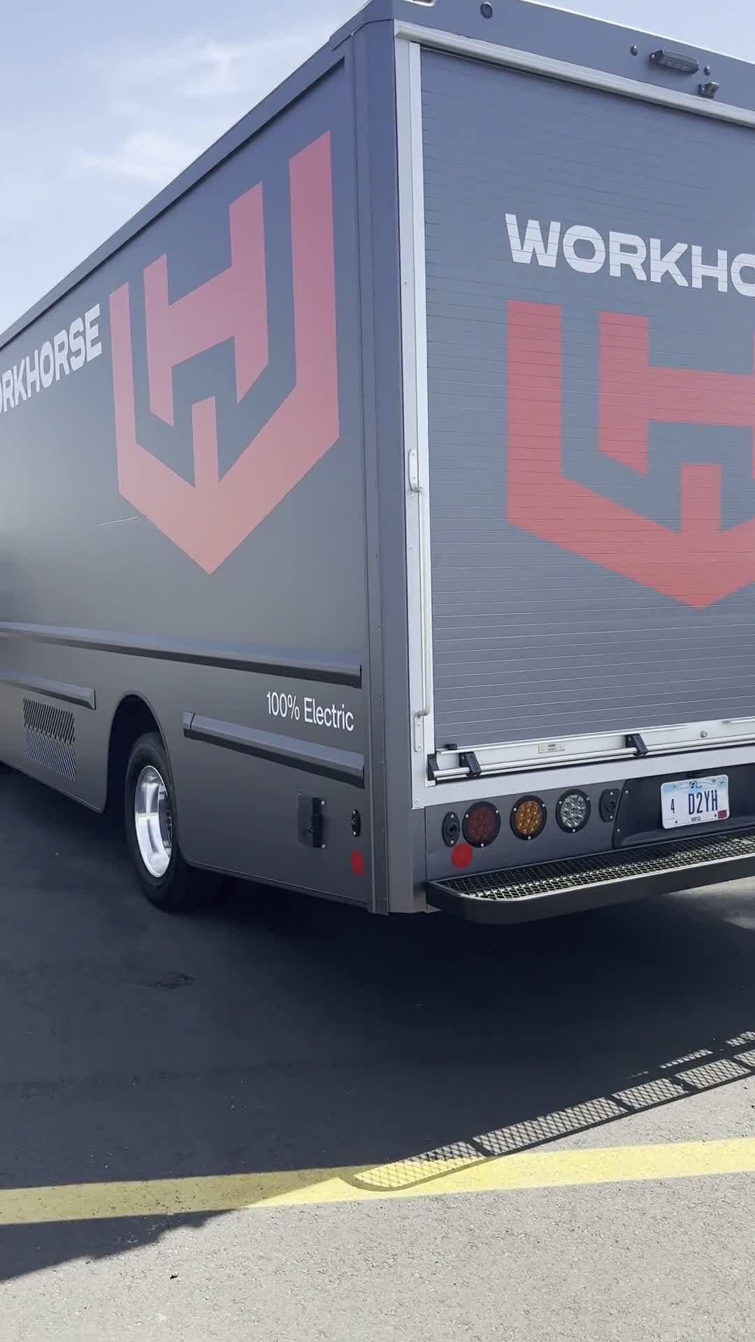 A vertical walkaround video of a graphite gray Workhorse W56 electric step van.
