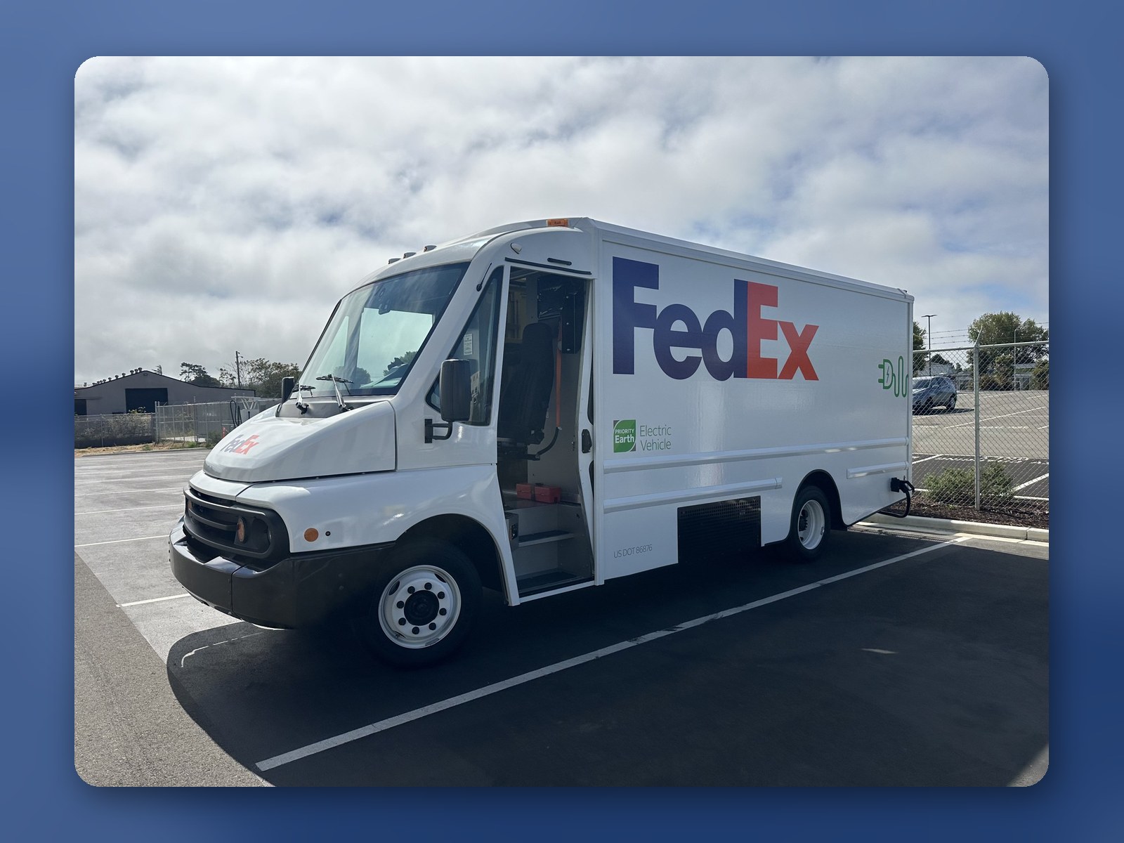 A white Workhorse W56 step van in FedEx Ground service, parked at a delivery facility.