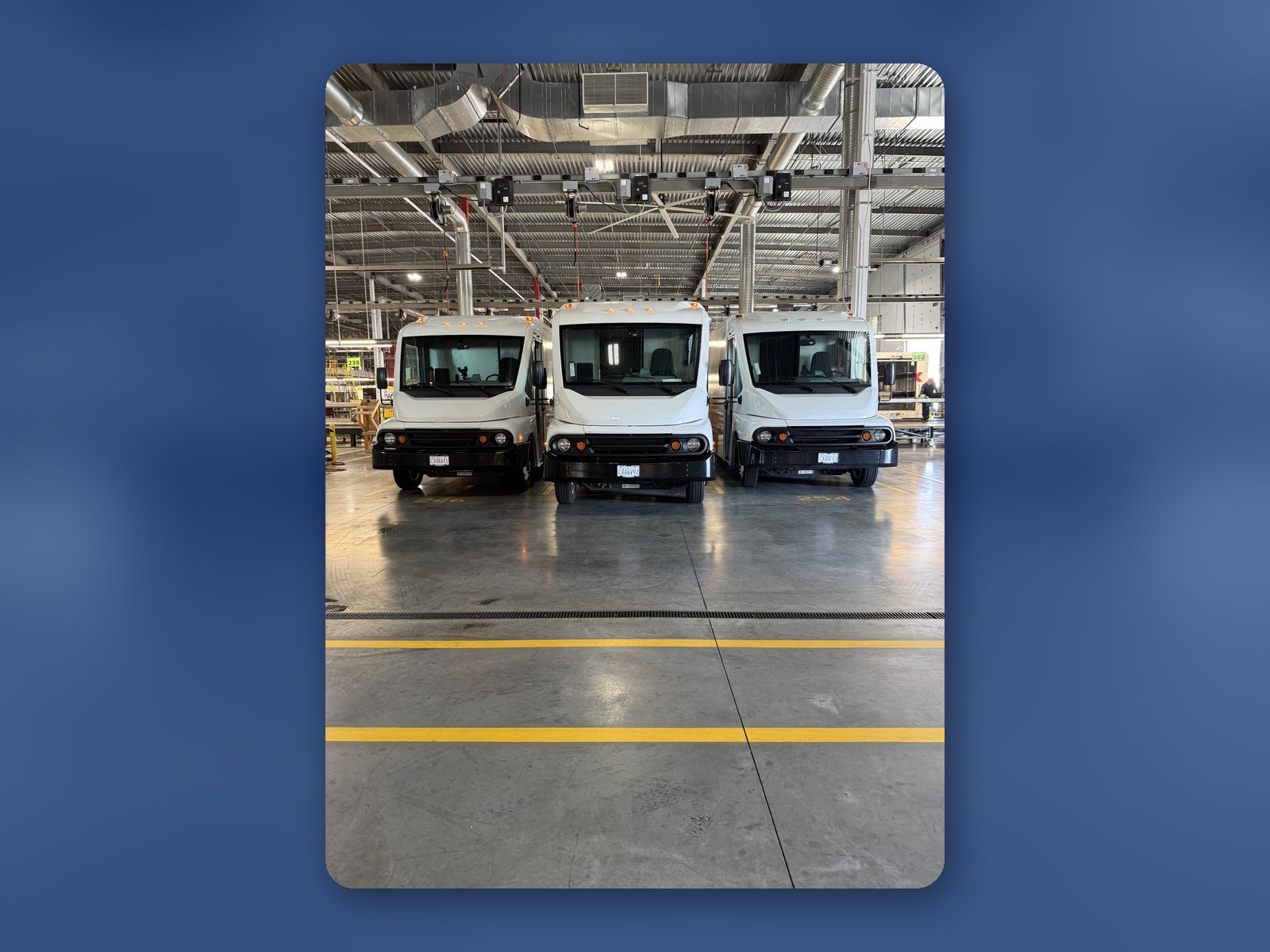 Workhorse W56 step vans lined up inside the Kingsburg Truck Center upfit shop.